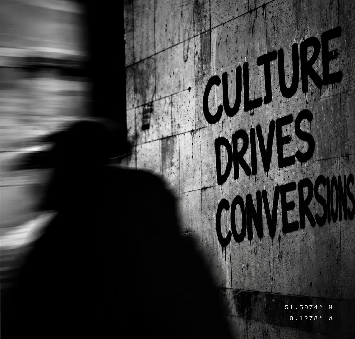Motion-blurred wall at night — culture drives conversions
