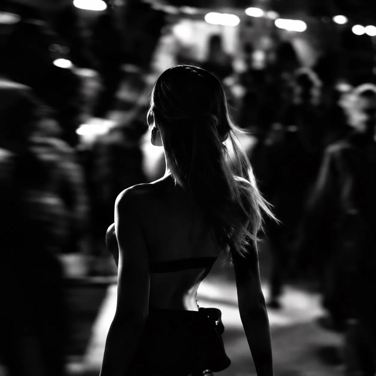 Silhouette on a night street, in motion